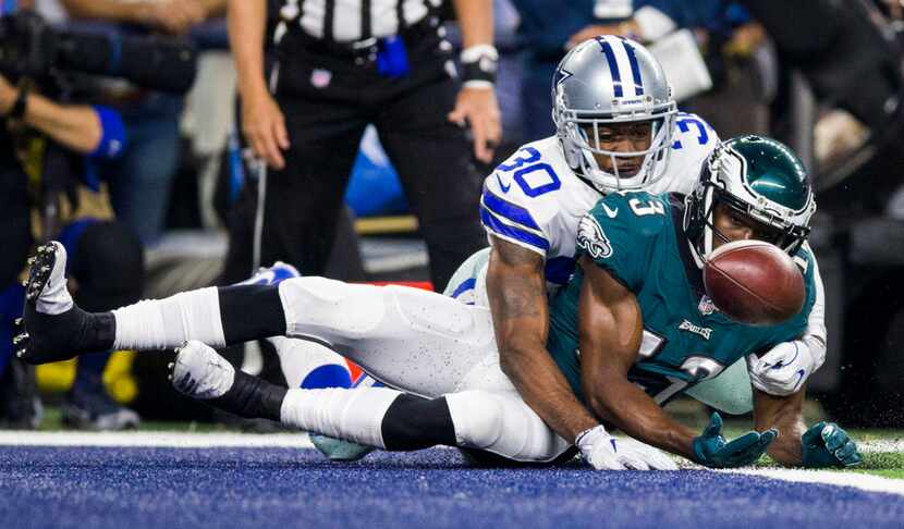 Dallas Cowboys cornerback Anthony Brown (30) tackles Philadelphia Eagles wide receiver...