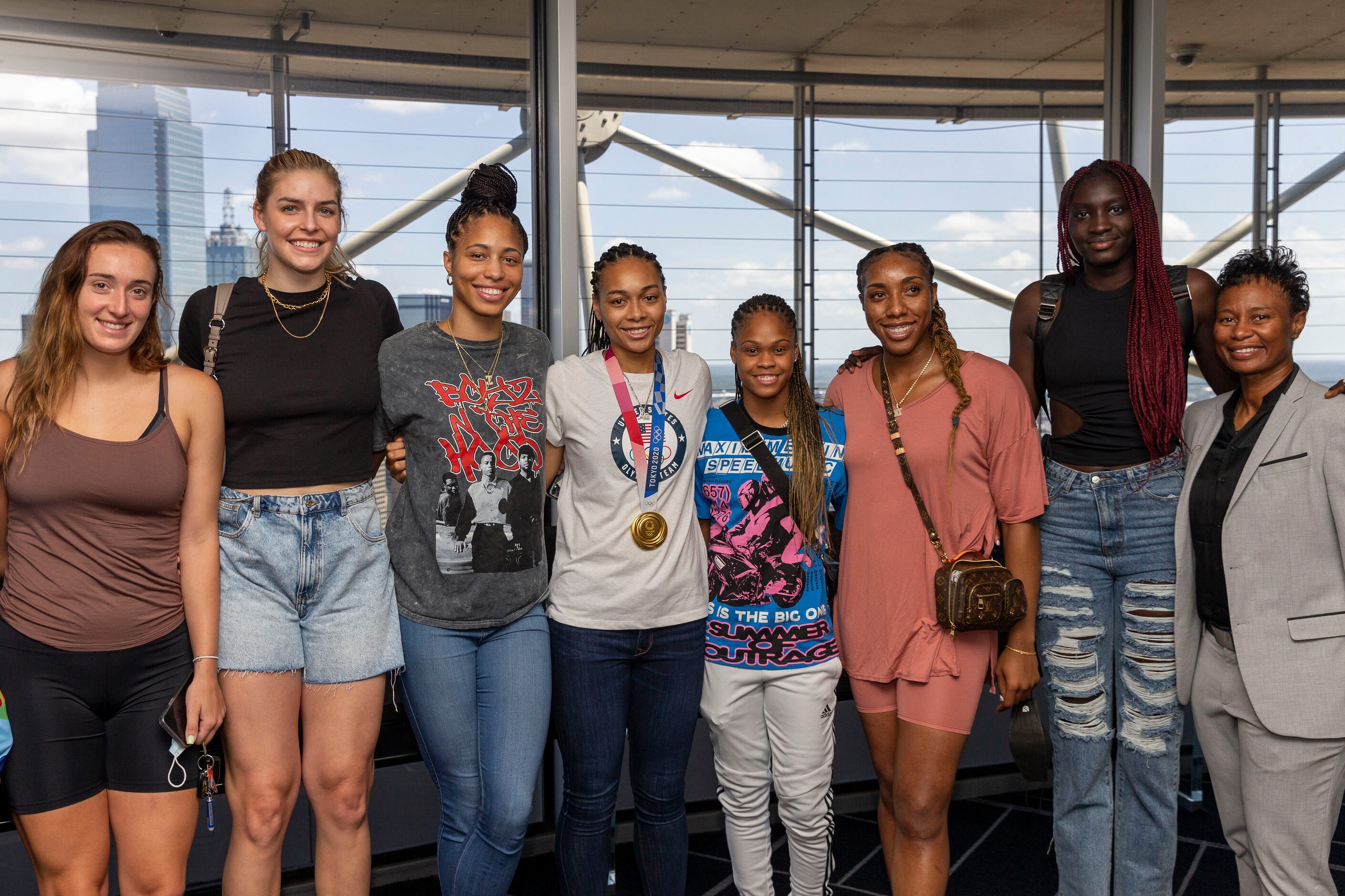 Allisha Gray, Olympic gold medalist and Dallas Wings guard, poses with her Dallas Wings...