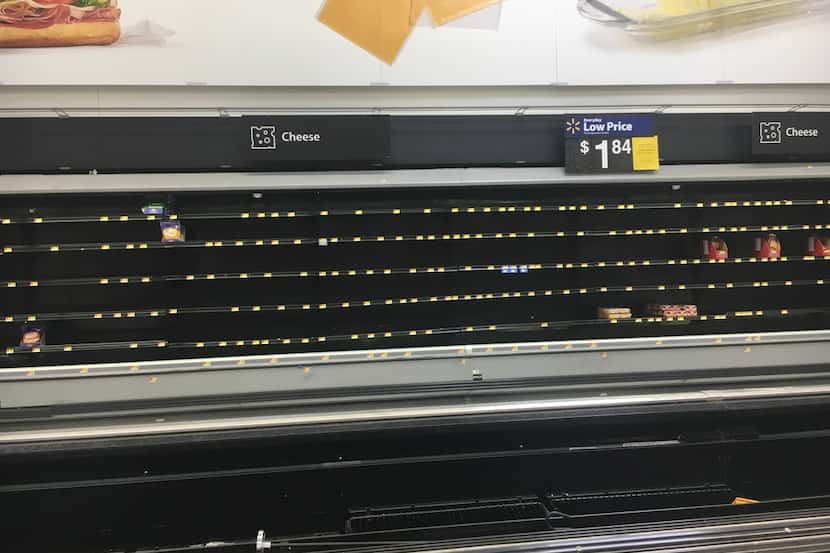 The cheese section of the Walmart Supercenter in Far East Dallas was barren Tuesday.