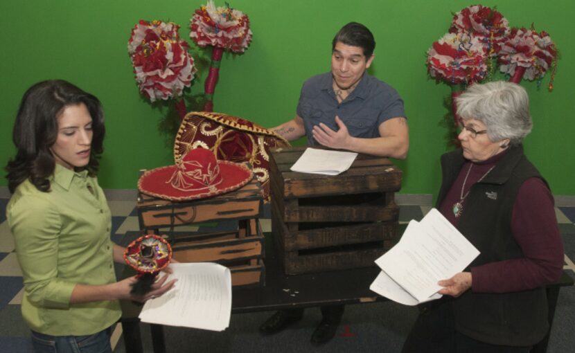 Vanessa DeSilvio, left, and David Lugo, center, go through scenes of "Mariachi Girl" with...