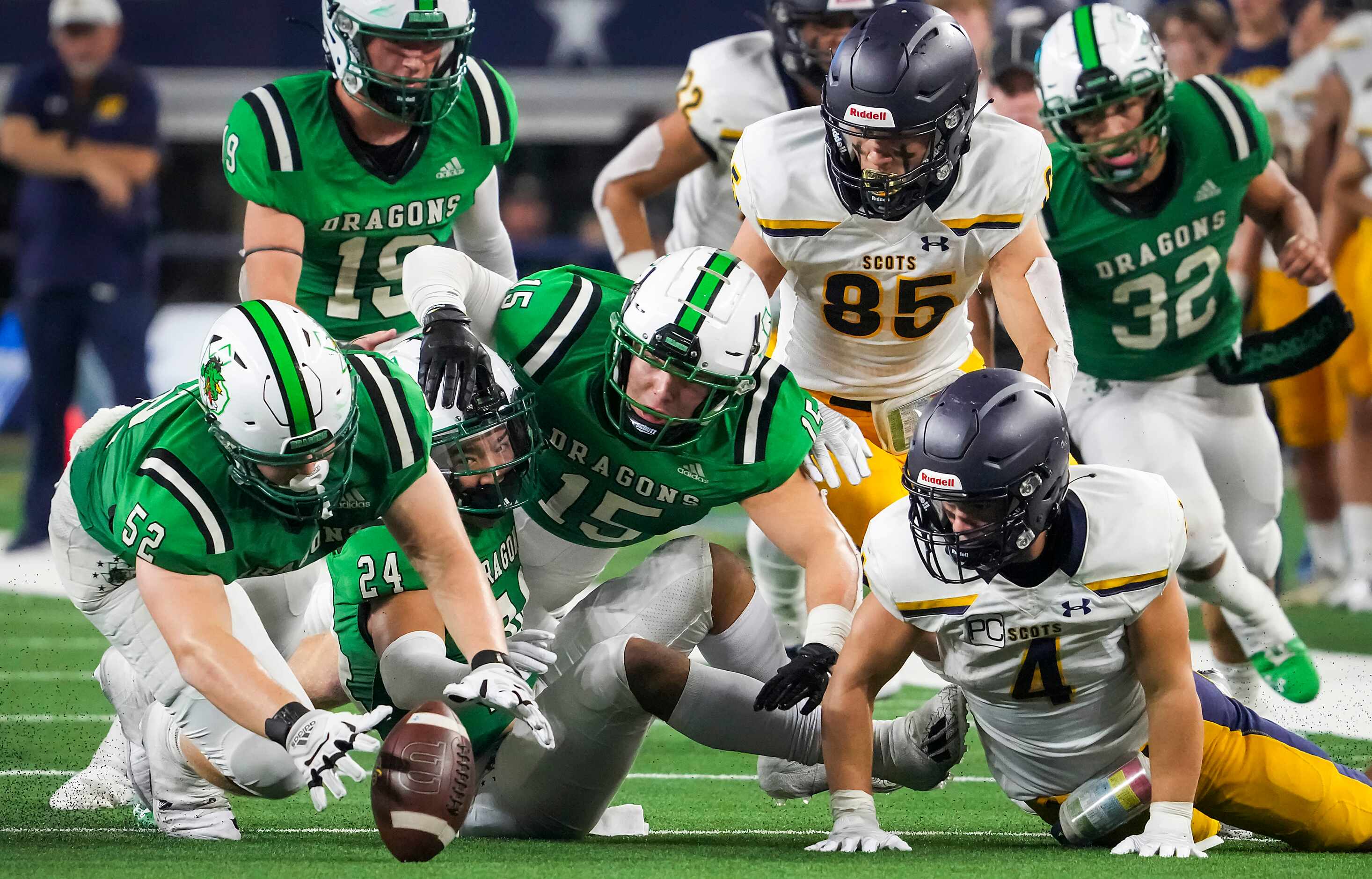 Southlake Carroll defensive lineman Cade Parks (52) recovers a fumble by Highland Park...