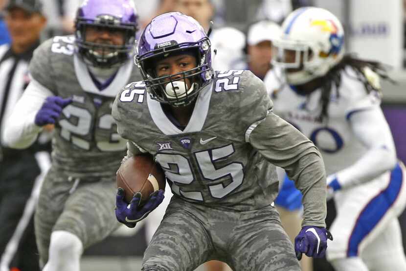 TCU 's KaVontae Turpin (25) returns a punt for a touchdown against Kansas in the first...