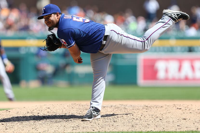 Joseph Ortiz of the Texas Rangers pitches in the eighth inning of a game against the Detroit...