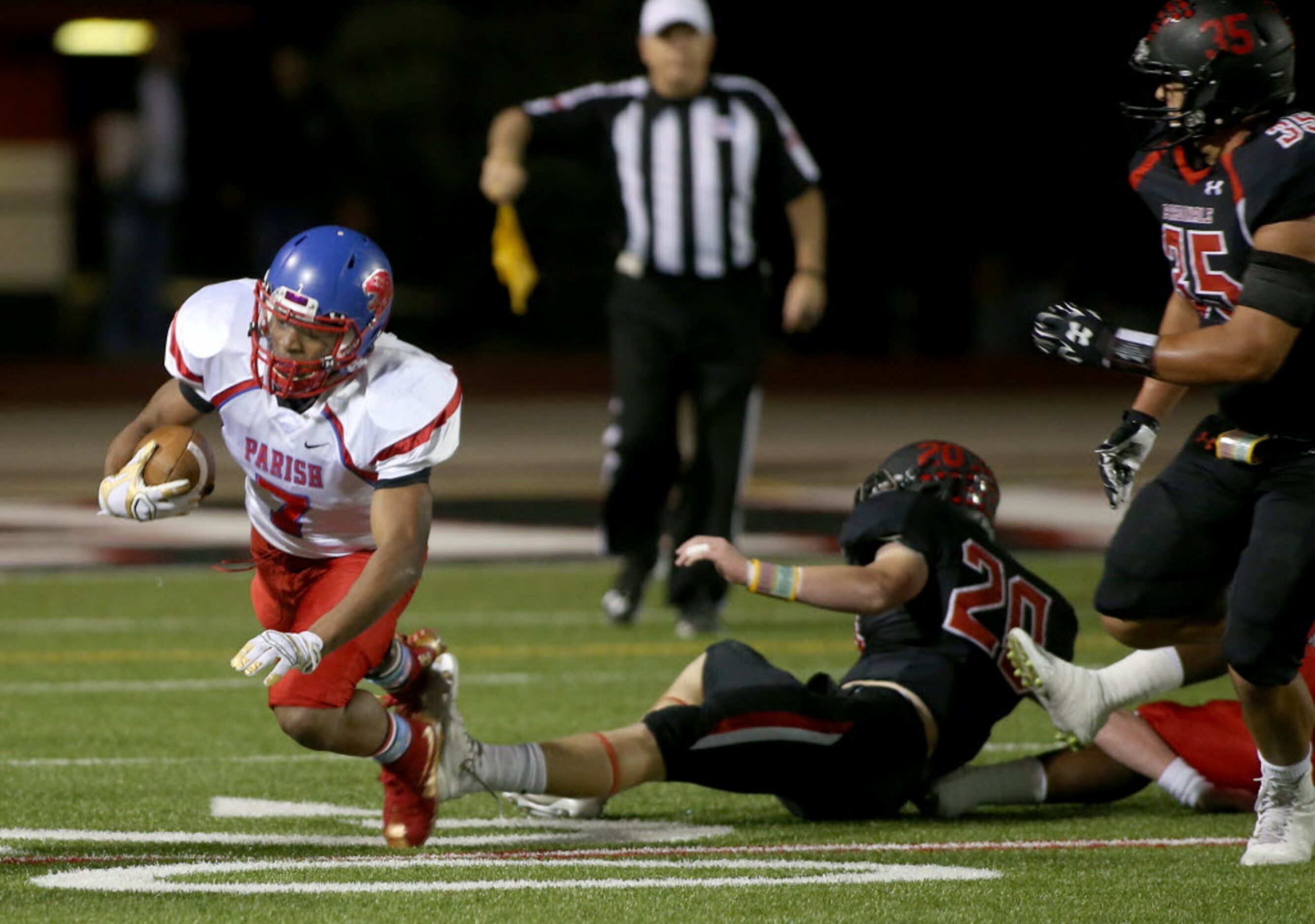 Parish Episcopal’s Dominic Williams (7) is tripped by Fort Worth Christian’s Conner Worsham...