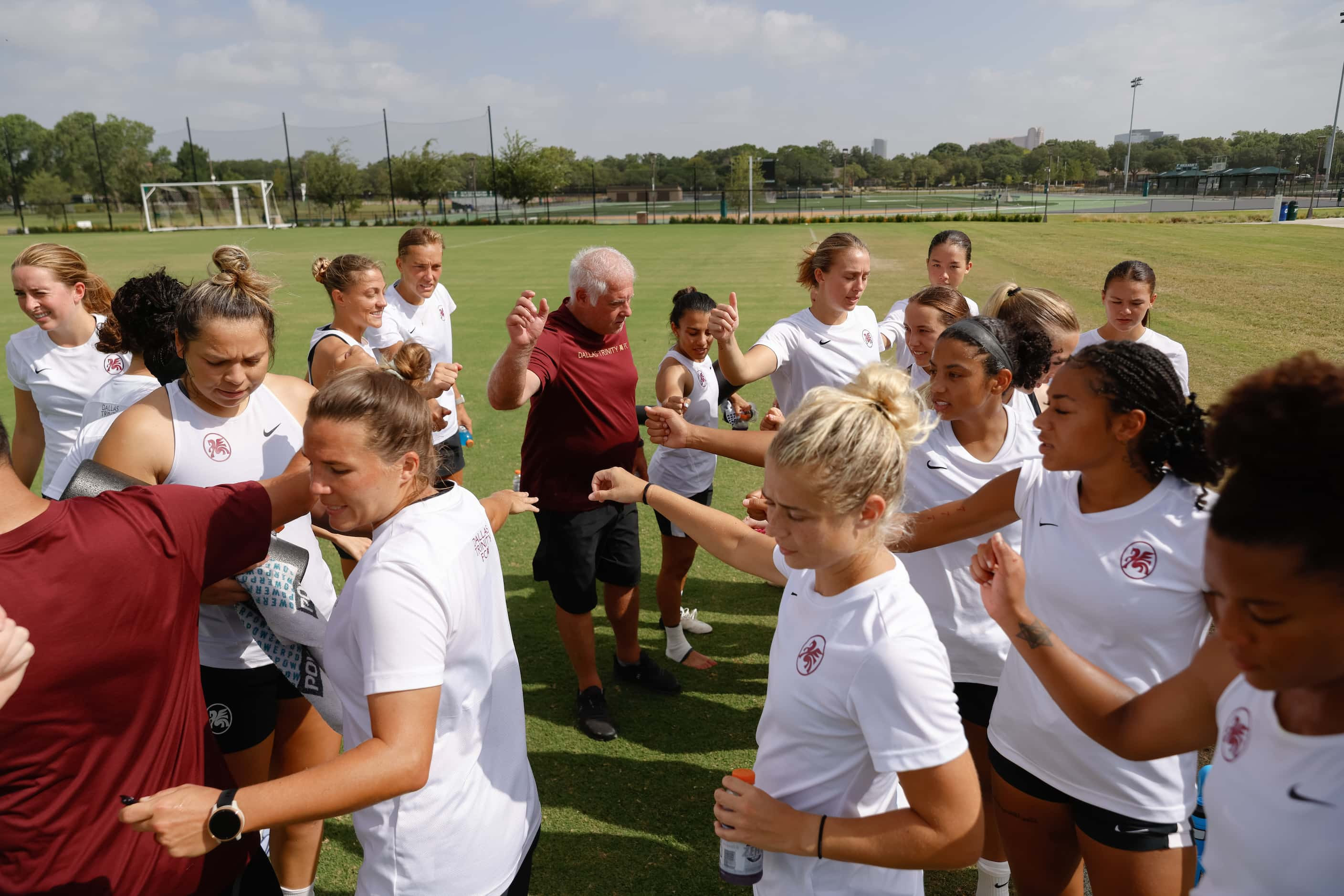 Dallas Trinity FC General Manager Chris Petrucelli, center left, breaks the huddle with the...