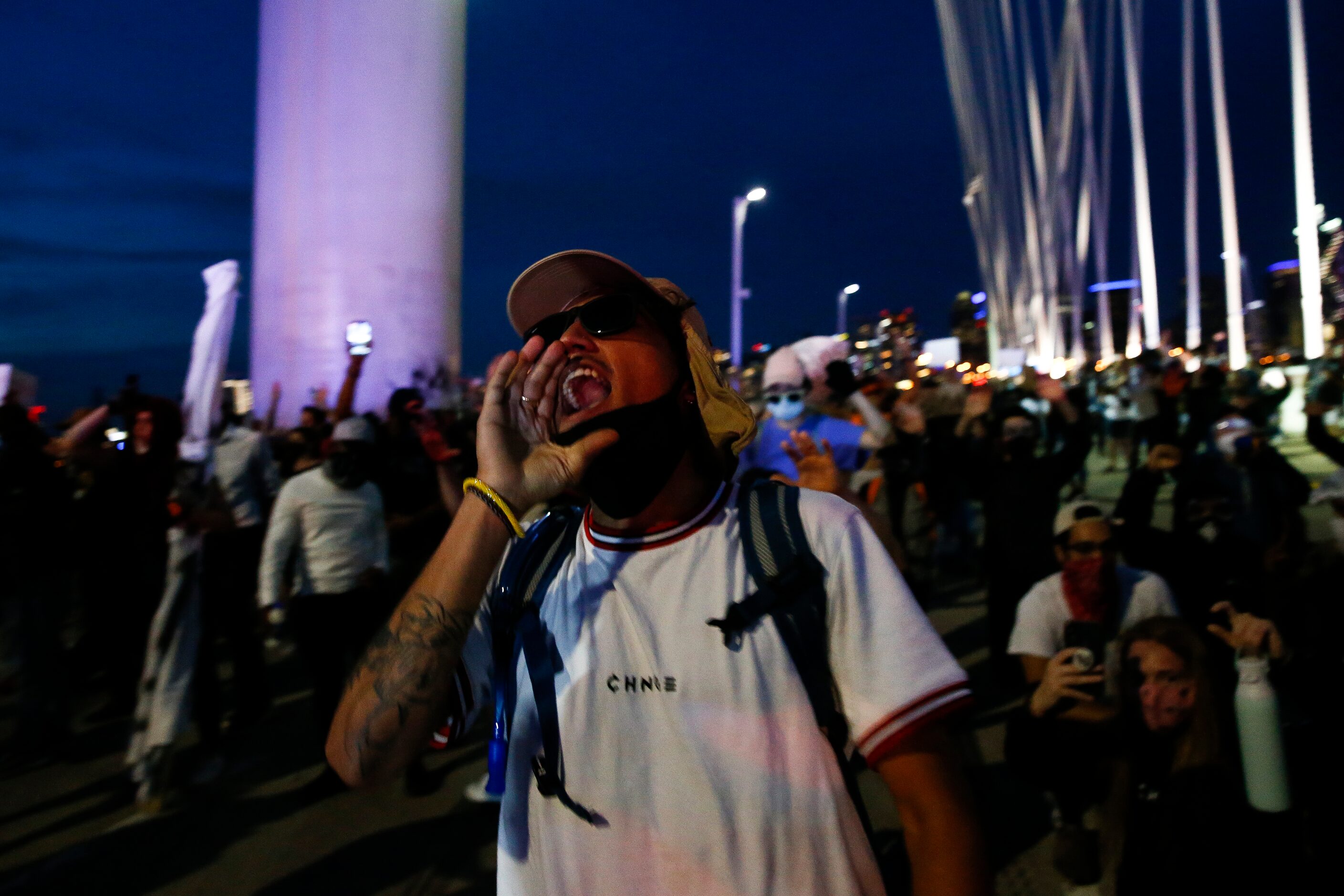 Protesters march onto the Margaret Hunt Hill Bridge as the demonstrate against police...