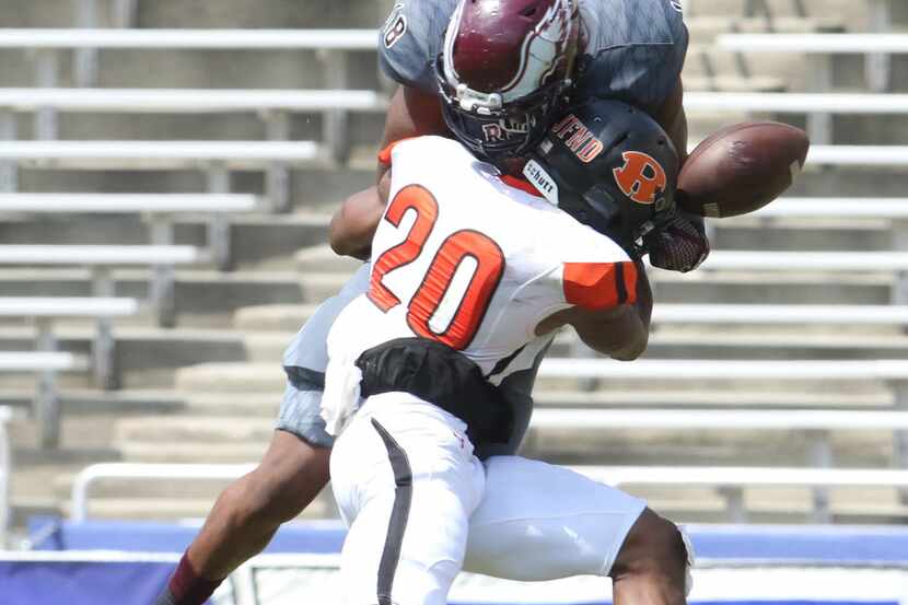 Rockwall defensive back Anfernee Orji jars the ball loose from Rowlett receiver Donald...