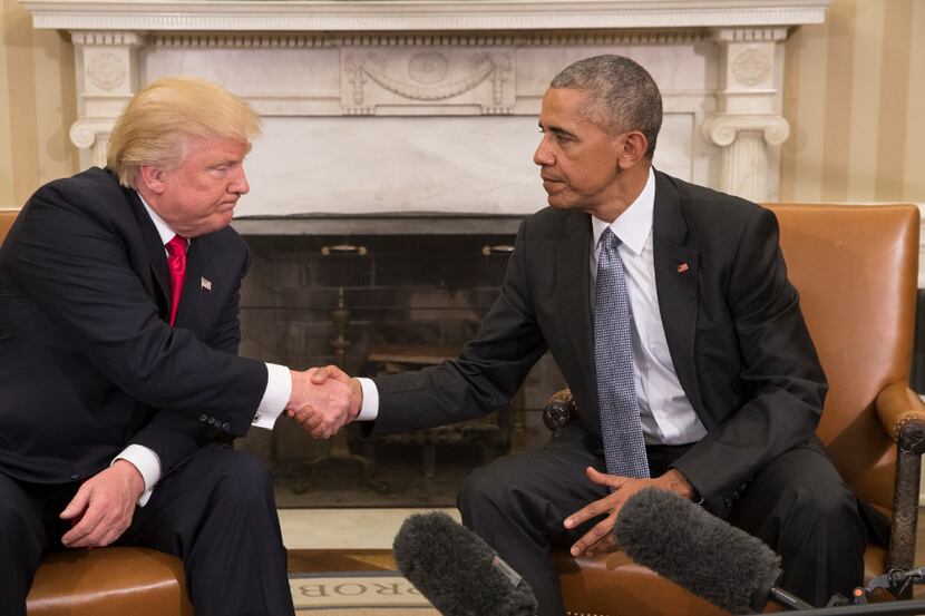 Donald Trump, the president-elect, shakes hands with President Barack Obama during a meeting...
