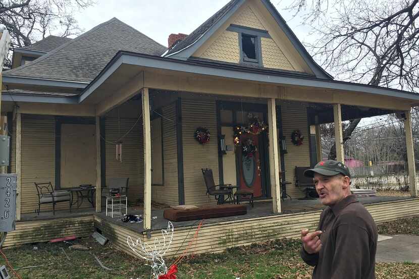 John Grindle in front of the historic South Dallas house he hopes to restore ... at some...