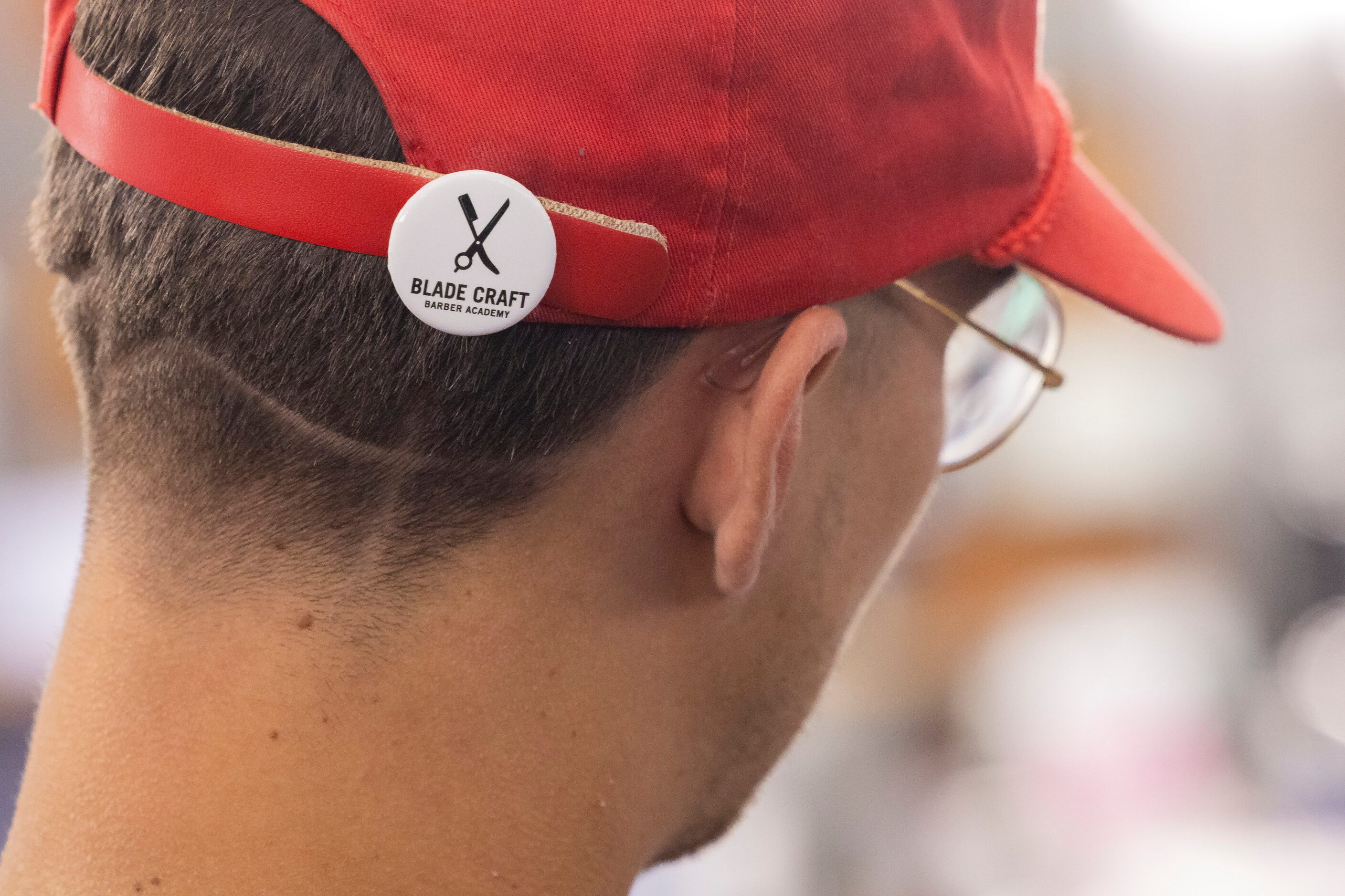 A student wears a Blade Craft Barber Academy during class at the Blade Craft Barber Academy...