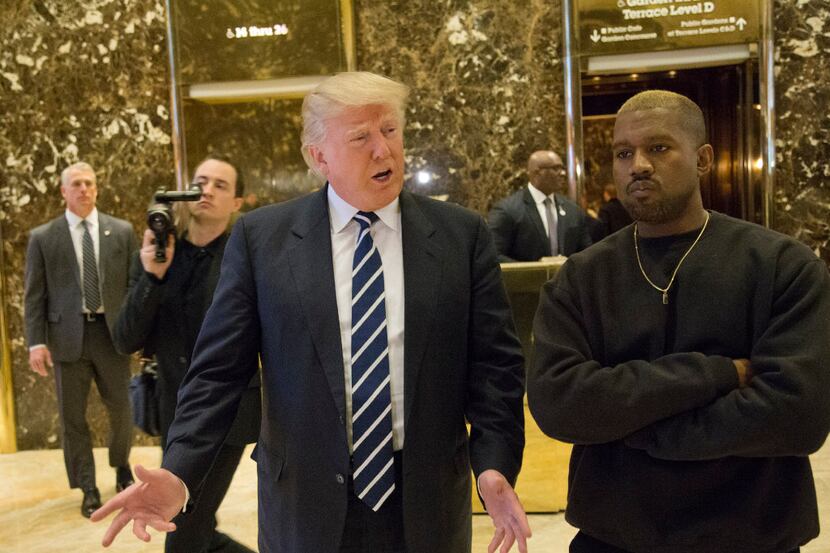President-elect Donald Trump, left, and Kanye West pose for a picture in the lobby of Trump...