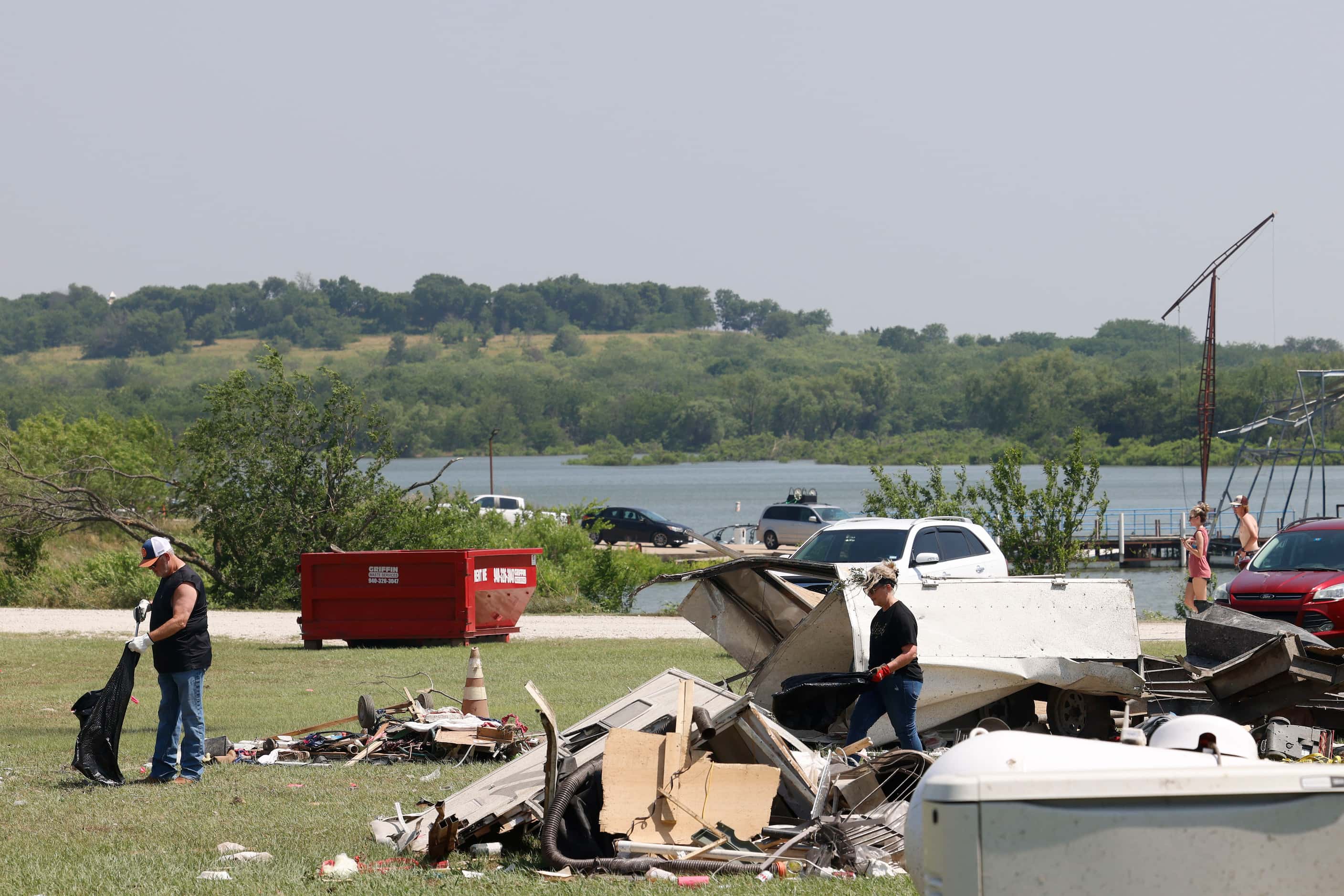 Volunteers works on collecting debris, on Sunday, May 26, 2024, at Ray Roberts Marina in...