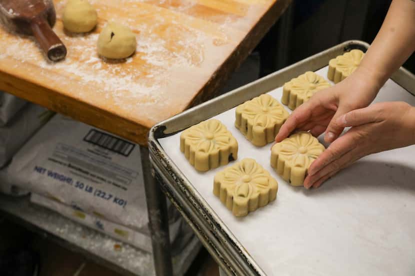 The mooncakes are laid on trays after being prepared in Jeng Chi’s kitchen.