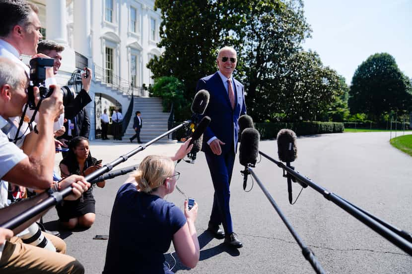 President Joe Biden speaks to reporters before boarding Marine One on the South Lawn of the...