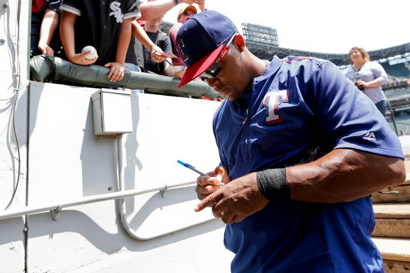 Jun 21, 2015; Chicago, IL, USA; Texas Rangers Adrian Beltre signs autographs before the game...