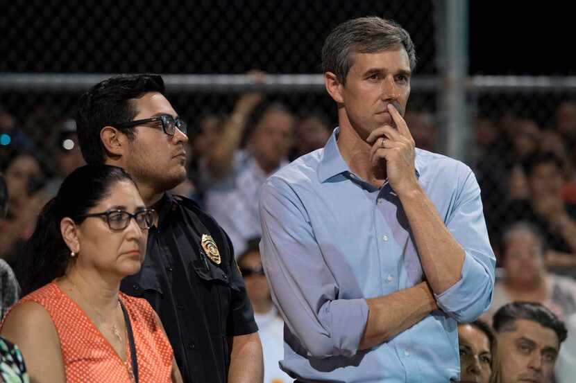 Beto O'Rourke  looks on before speaking at a prayer and candle vigil in El Paso on Aug. 4,...