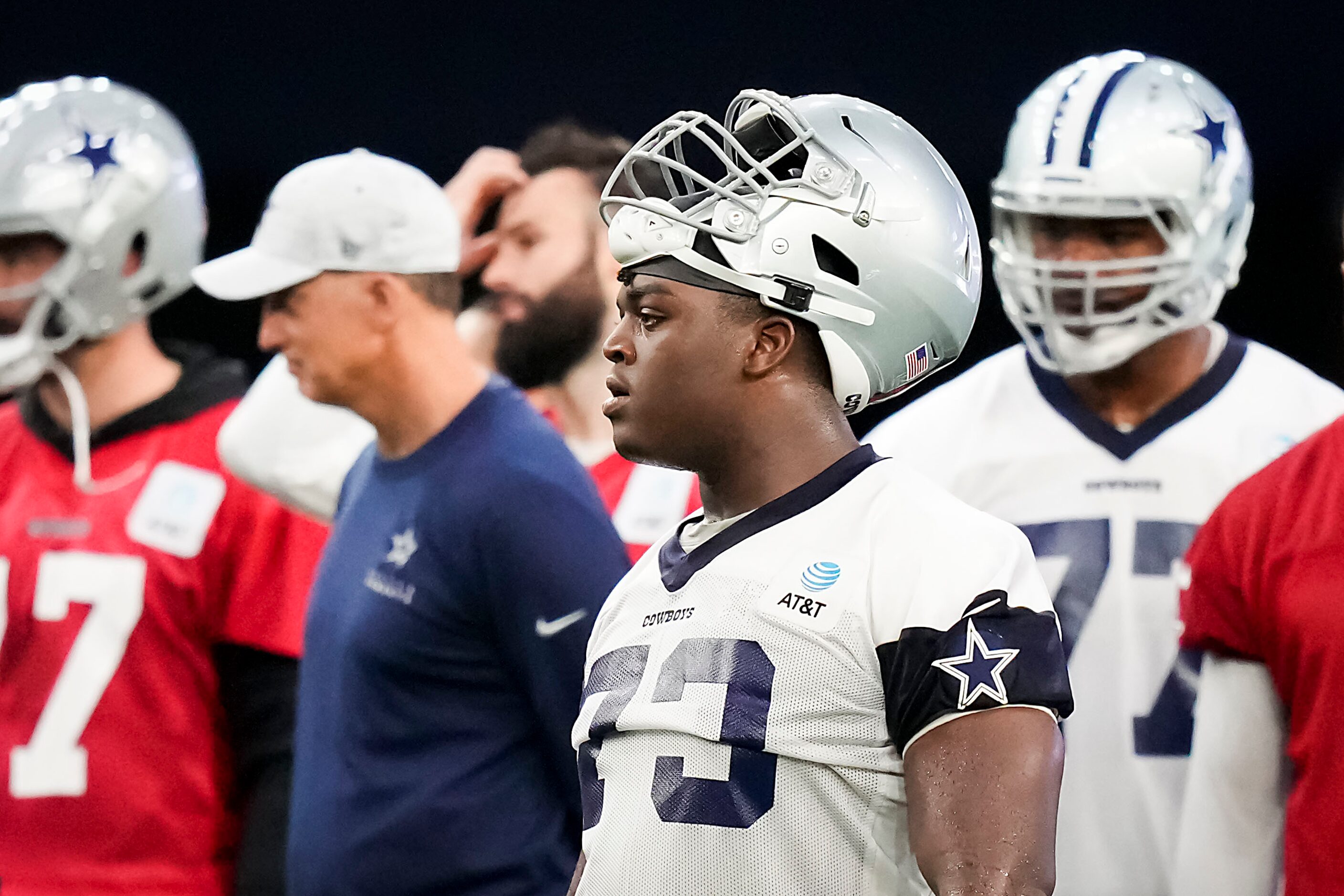 Dallas Cowboys offensive lineman Tyler Smith (73) looks on between drills during the OTA...