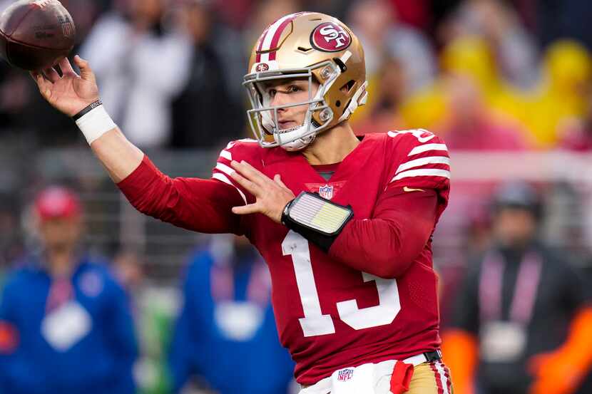 San Francisco 49ers quarterback Brock Purdy passes against the Seattle Seahawks during the...