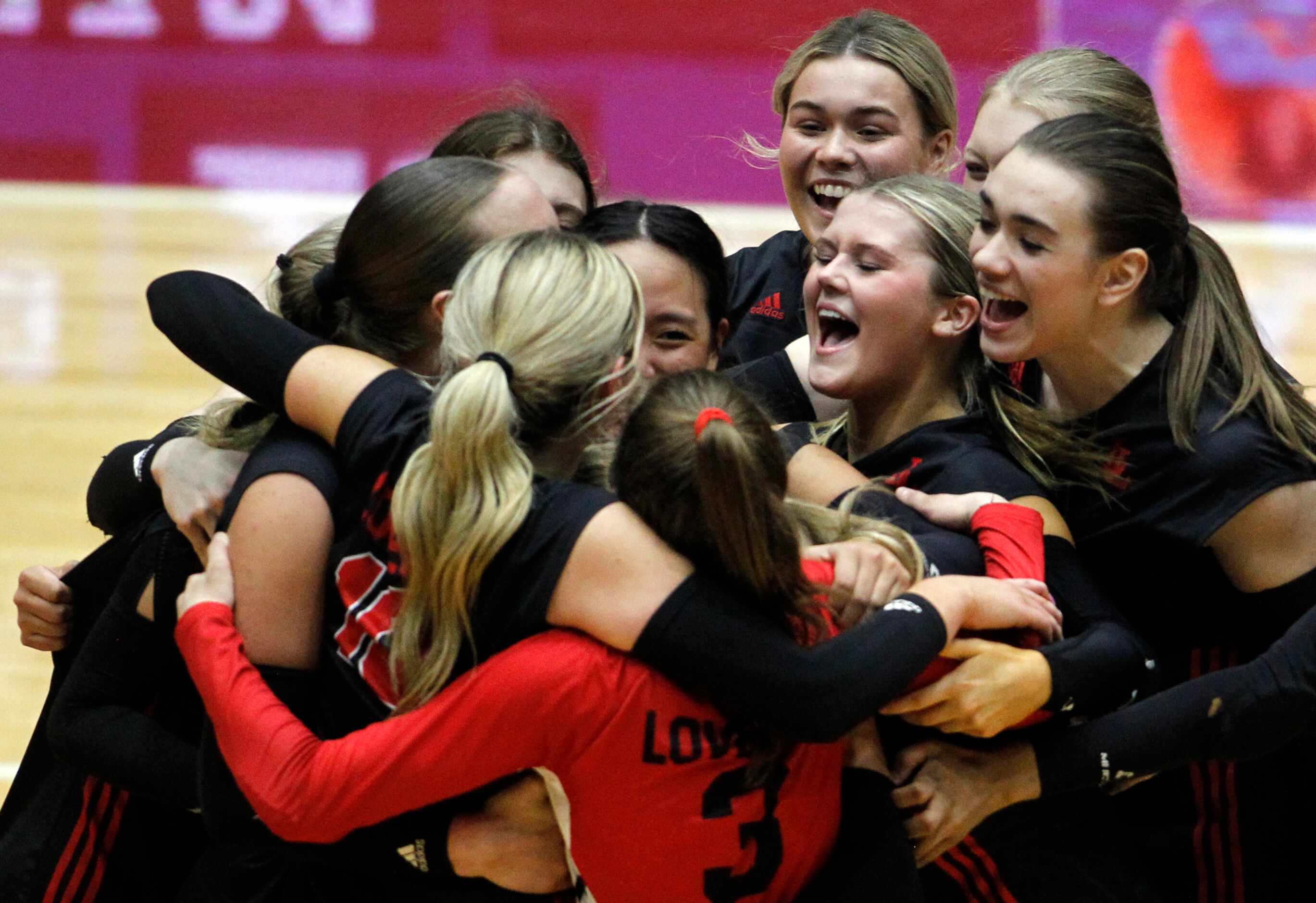 Lucas Lovejoy players celebrate on the court after their straight sets victory over Lamar...