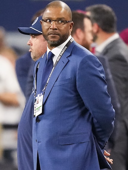 Dallas Cowboys vice president of player personnel Will McClay watches the teams warm up...