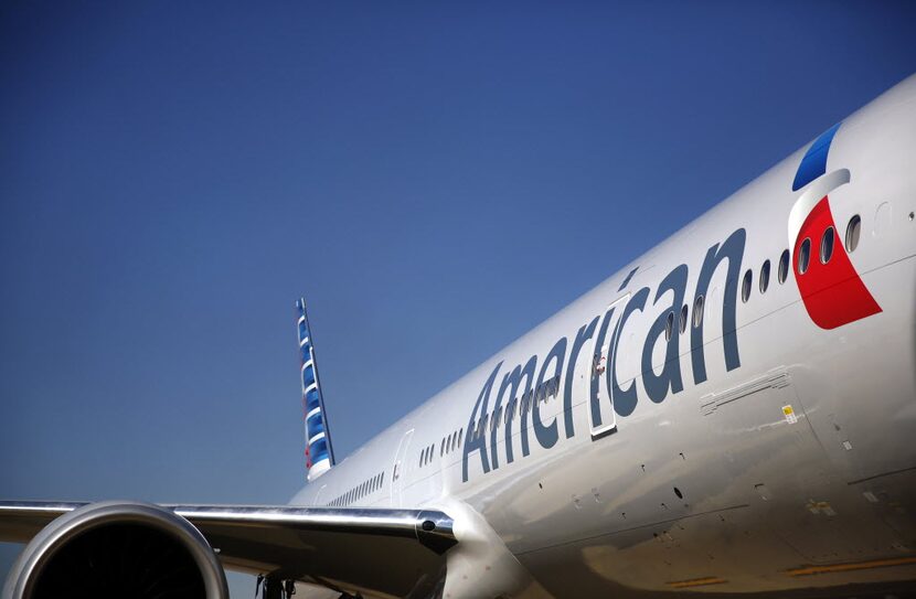 The freshly painted American Airlines 777 bears the new logo and look at Terminal D where...