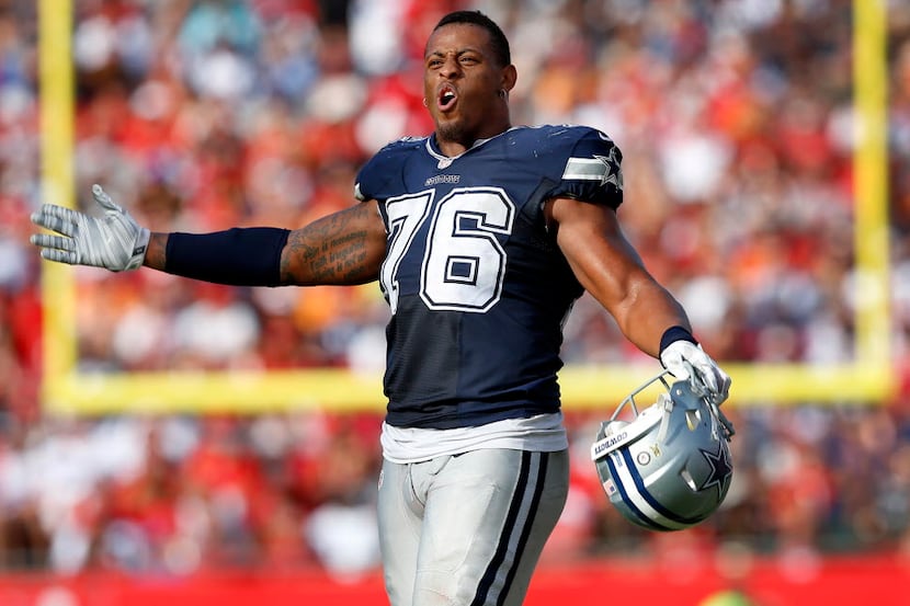 Dallas Cowboys defensive end Greg Hardy (76) reacts to the jeers sent his way by Tampa Bay...