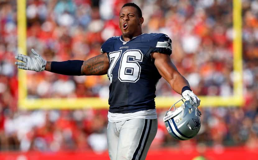 Dallas Cowboys defensive end Greg Hardy (76) reacts to the jeers sent his way by Tampa Bay...