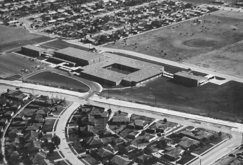 In this aerial shot from 1966, Neighborhoods and empty space ring Bishop Lynch High School....
