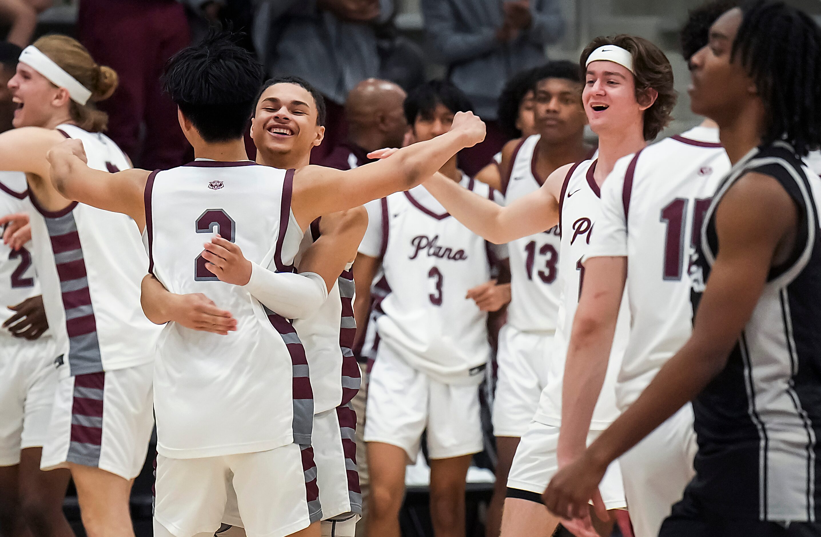 Plano guard Justin Buenaventura (2) celebrates with guard Micoh Sterling (facing) after a...