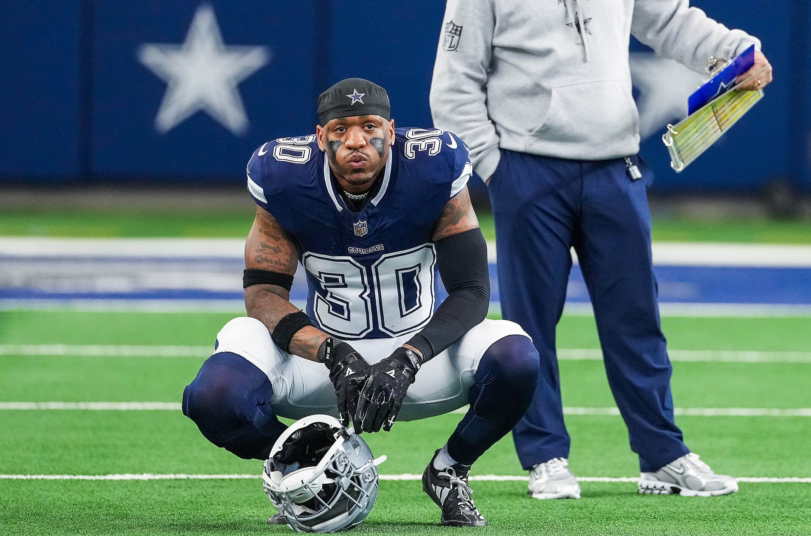 Dallas Cowboys safety Juanyeh Thomas looks out over the field after a loss to the Washington...