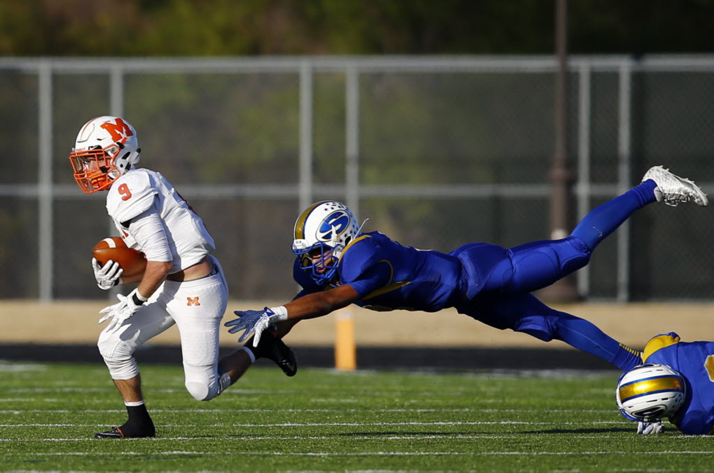 TXHSFB Mineola's Chantz Perkins (9) runs past Sunnyvale's Trey Sterling (3)  in their state...