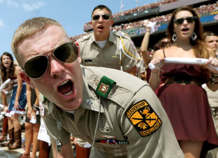 Michael Frobel, a member of A&M’s Corps of Cadets, joined other Aggie fans in a yell during...