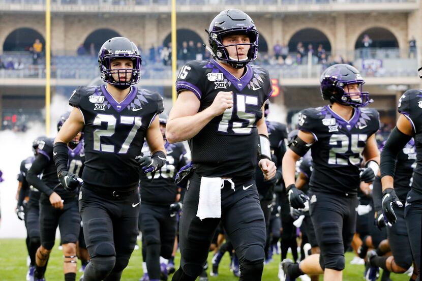 TCU Horned Frogs quarterback Max Duggan (15) leads his team onto the field to face the West...