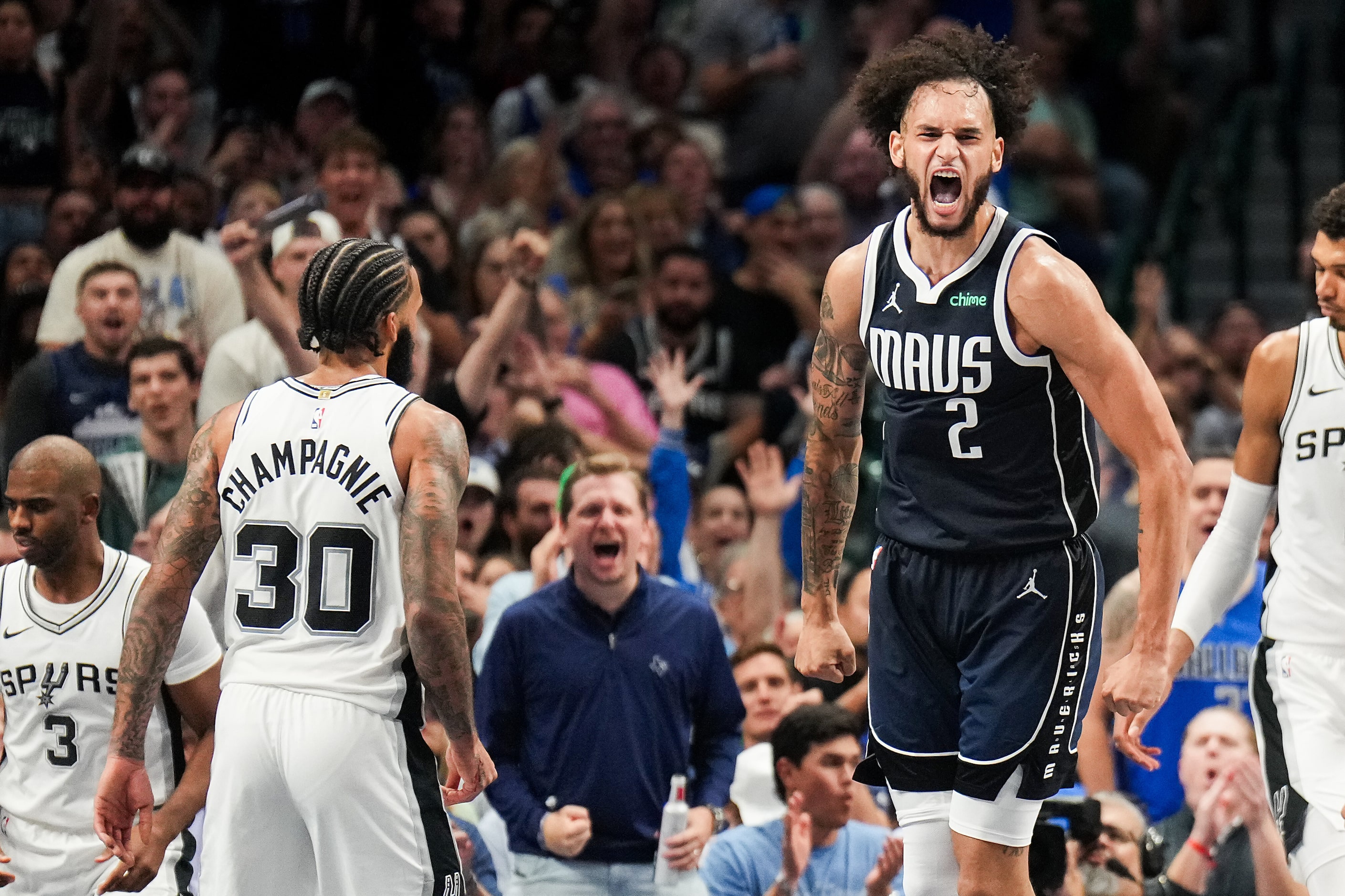 Dallas Mavericks center Dereck Lively II (2) celebrates after dunking past San Antonio Spurs...