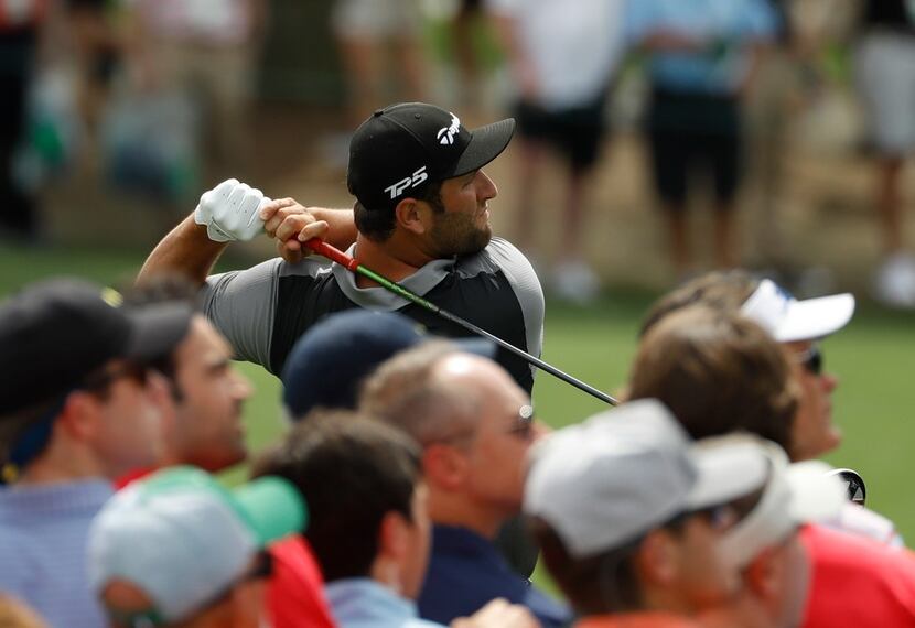 Jon Rahm, of Spain, hits on the third hole during the second round for the Masters golf...