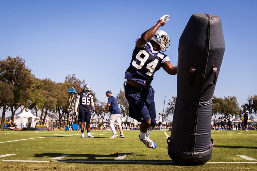 Dallas Cowboys defensive end Randy Gregory works against a blocking dummy during afternoon...