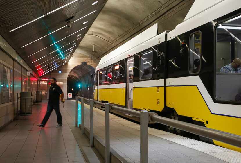 A passenger disembarks a DART Rail Red Line at CityPlace/Uptown Station in Dallas July 5,...