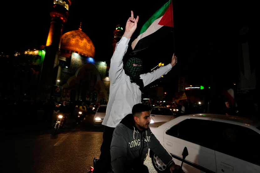 Iranian demonstrators wave a Palestinian flag during their anti-Israeli gathering at the...