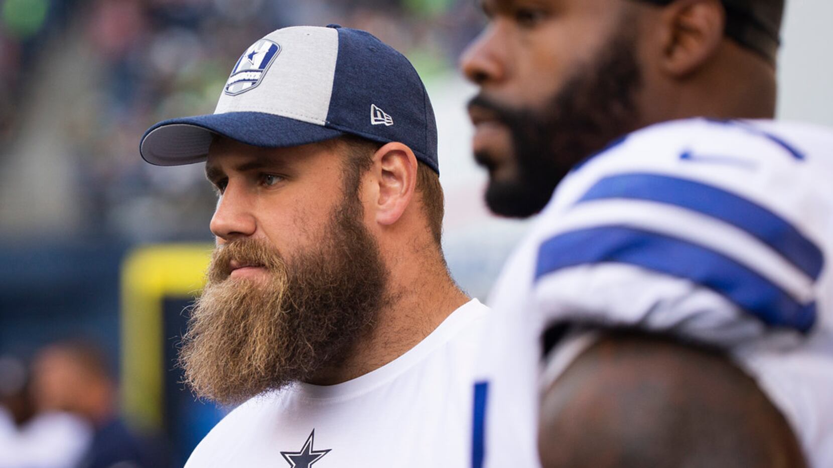 FILE - Cowboys center Travis Frederick watches from the sideline during the second half of a...