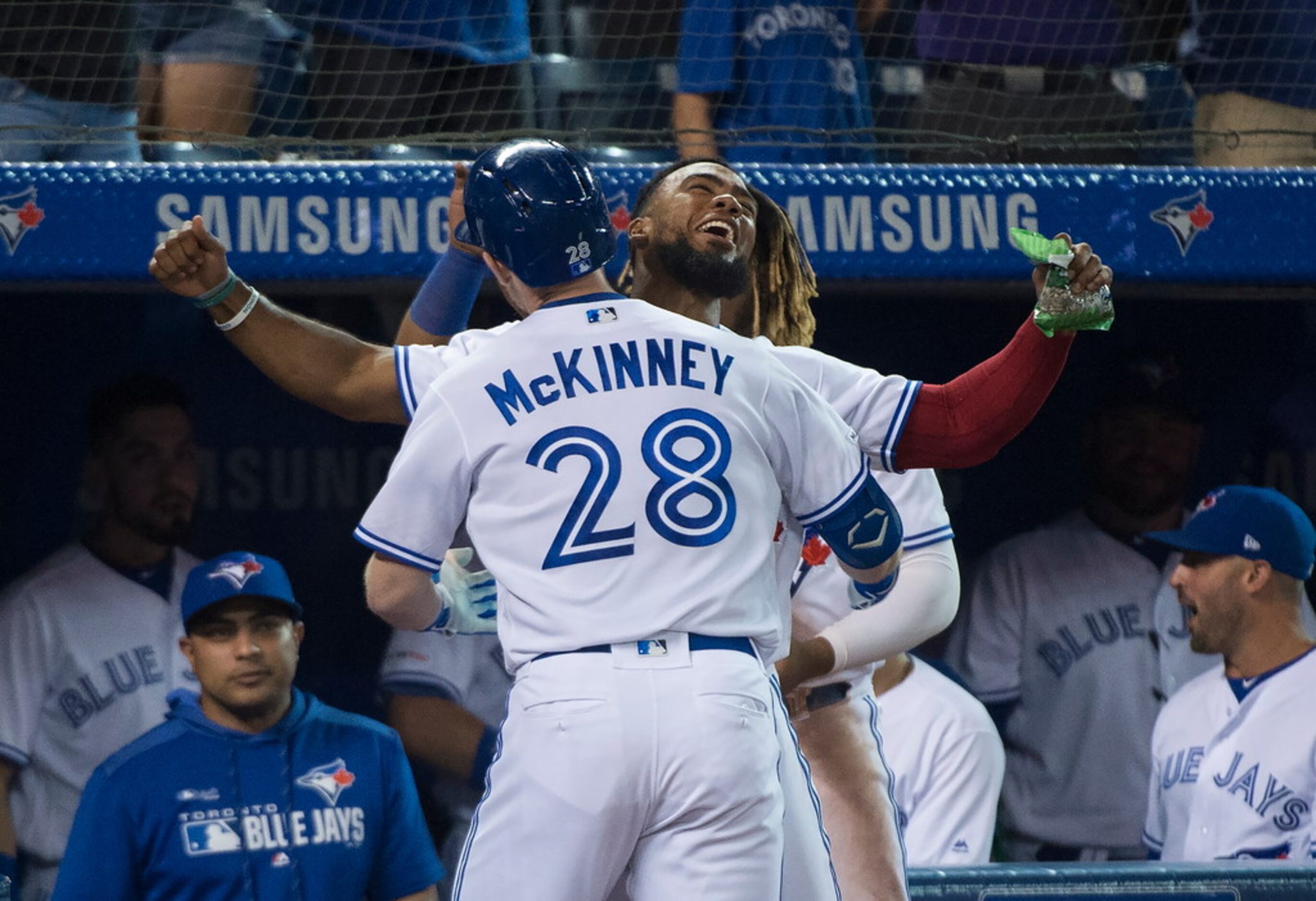 Toronto Blue Jays right fielder Billy McKinney (28) celebrates his solo home run with...