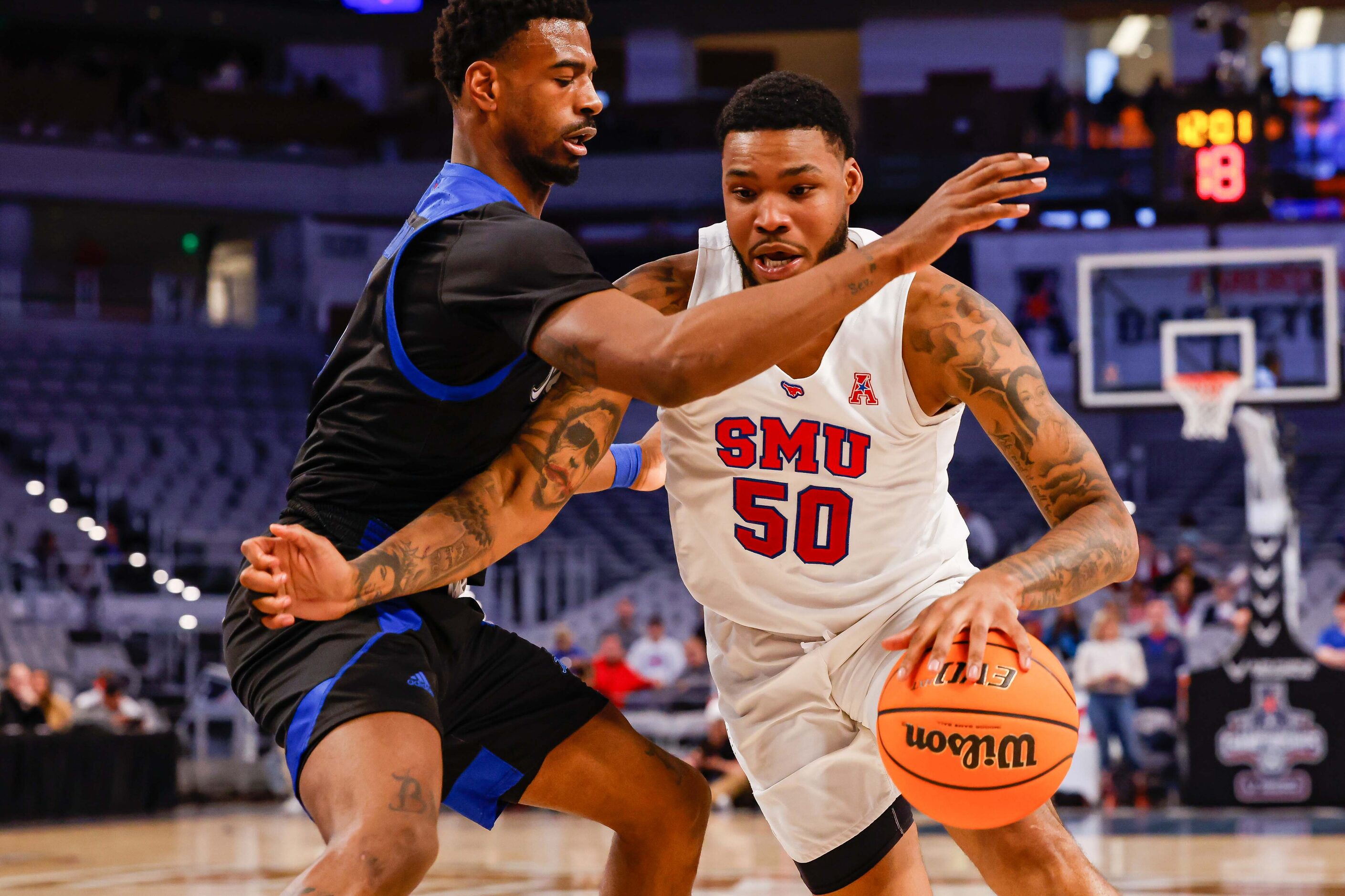 Southern Methodist Mustangs forward Marcus Weathers (50) goes around Tulsa Golden Hurricane...