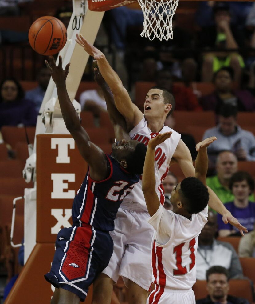 Allen guard Myron Fisher (22) has a shot defend by Converse Judson forward David Wacker (33)...