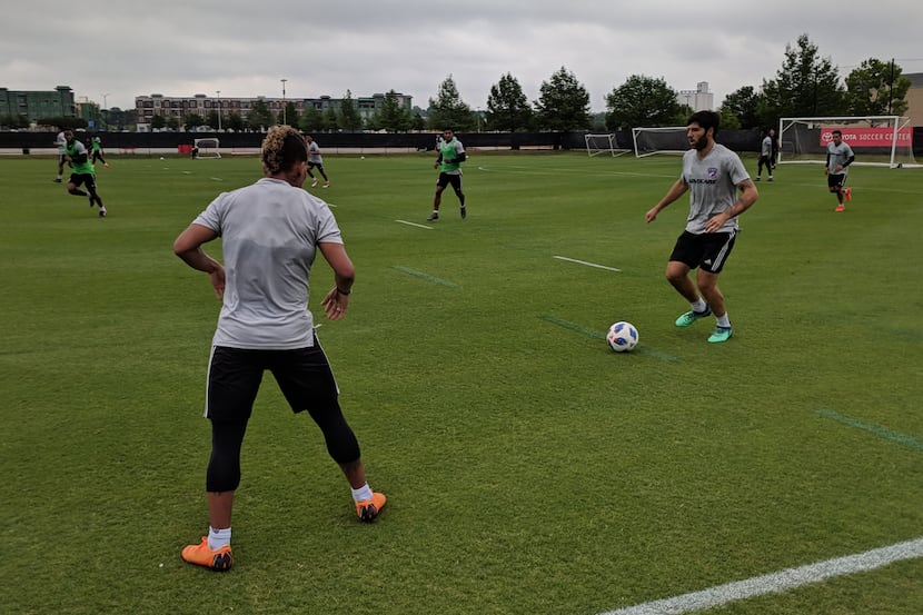Ryan Hollingshead and Michael Barrios work the ball up the left wing in training. (5-2-18)
