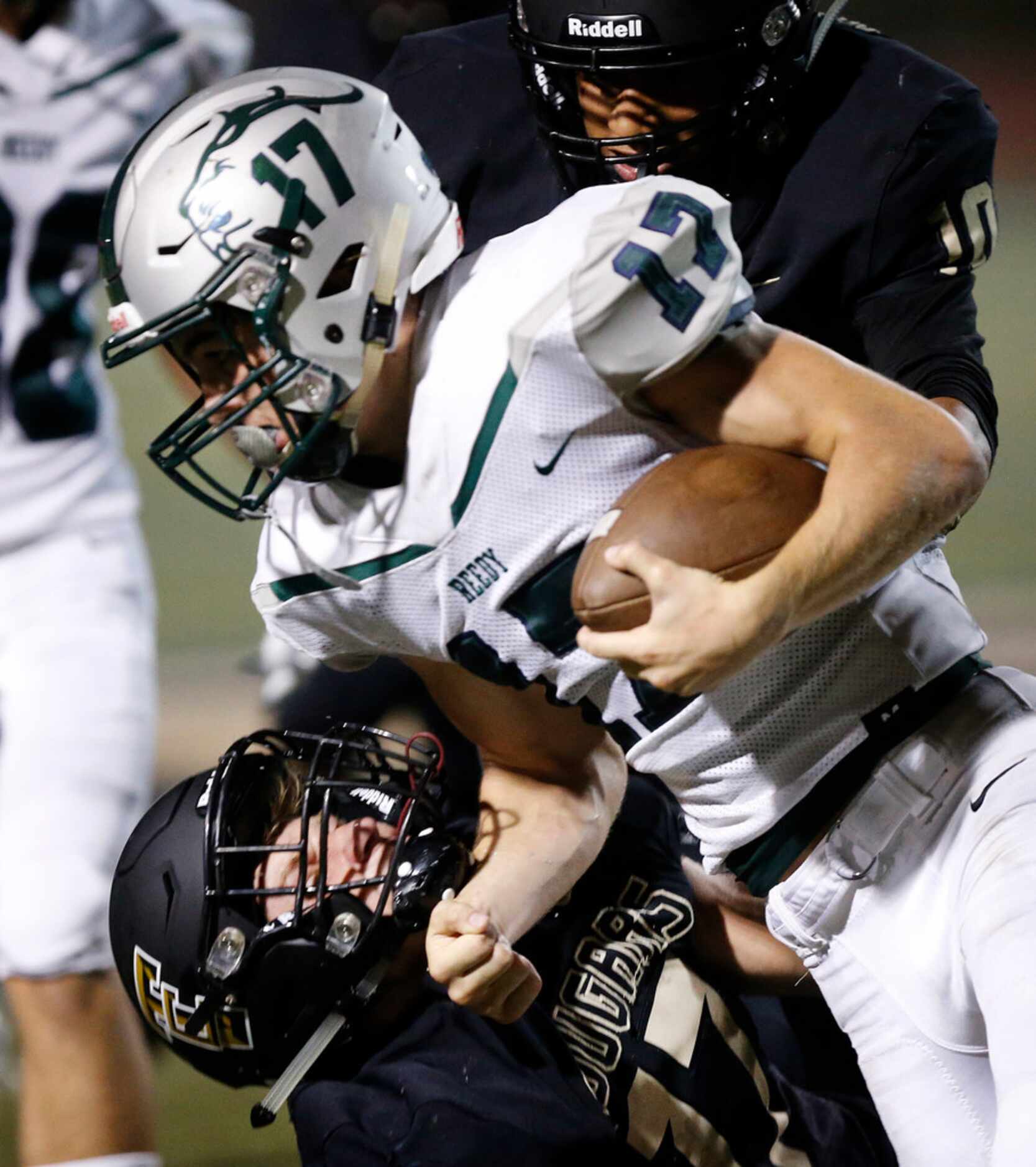 Frisco Reedy wide receiver Karston Farragut (17) is brought down by The Colony strong safety...