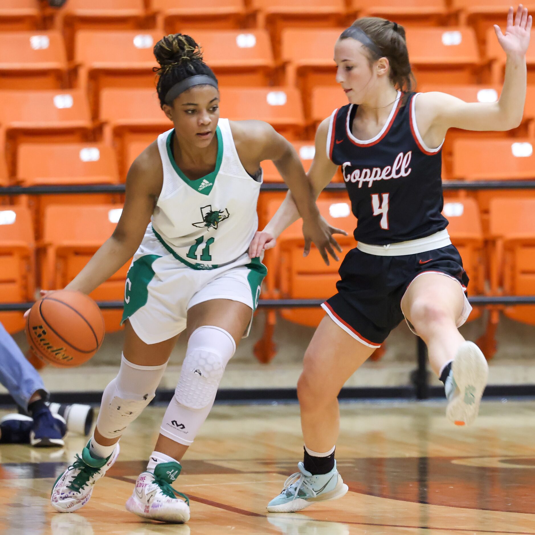 Southlake Carroll freshman guard Natalia Jordan (11) moves along the sideline with pressure...