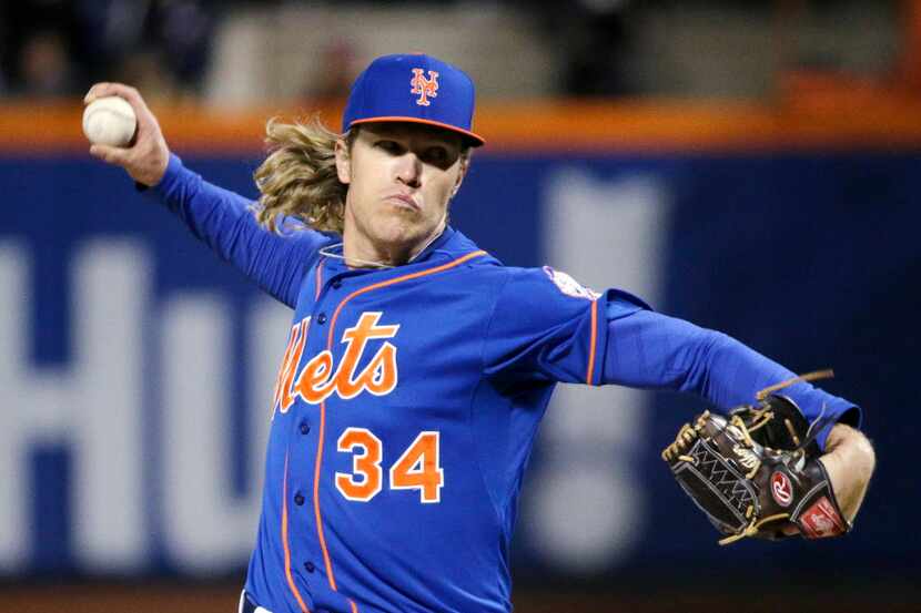 New York Mets pitcher Noah Syndergaard throws during the first inning of Game 2 of the...