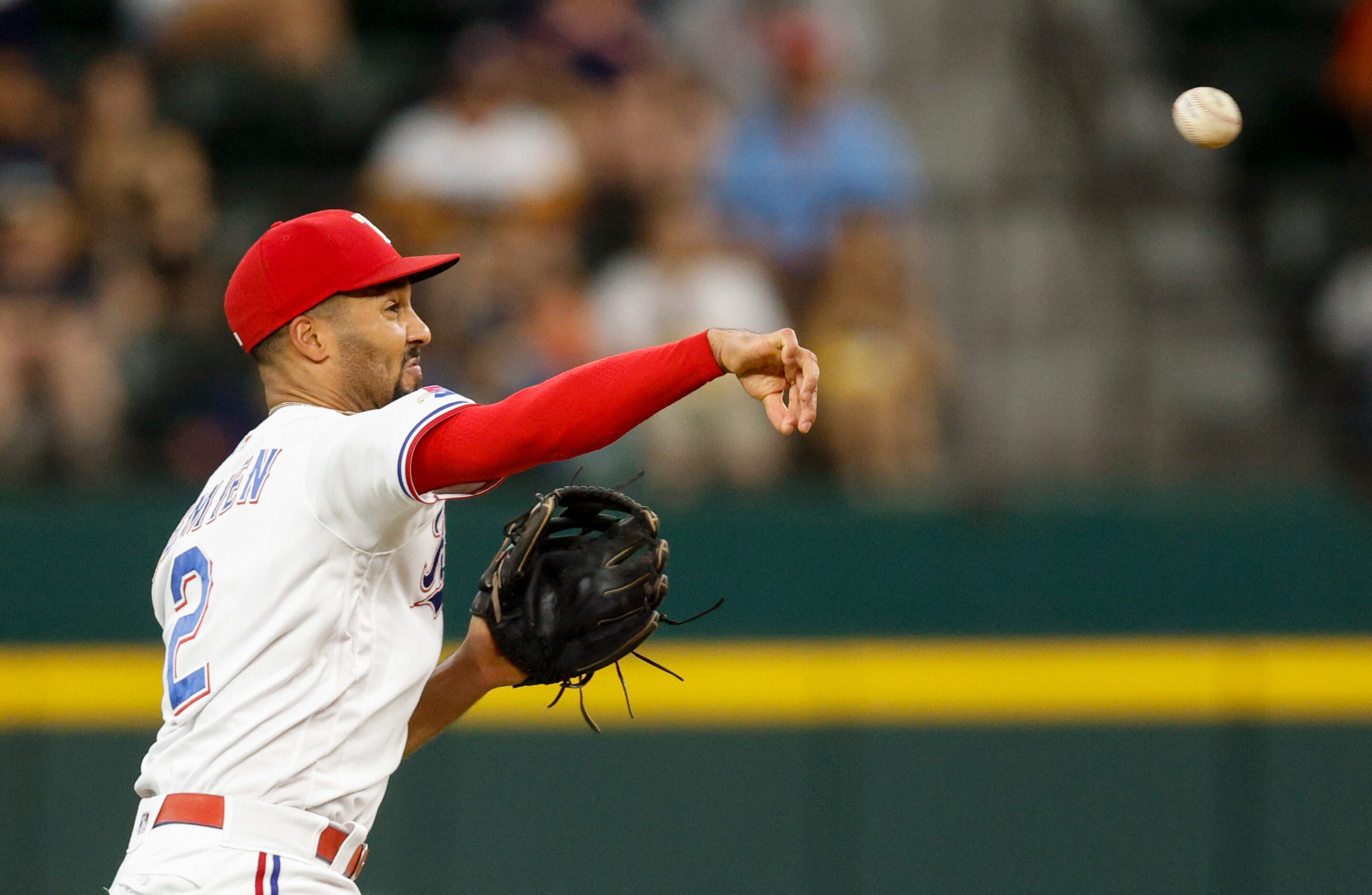 Texas Rangers second baseman Marcus Semien (2) throws to first base for an out during the...