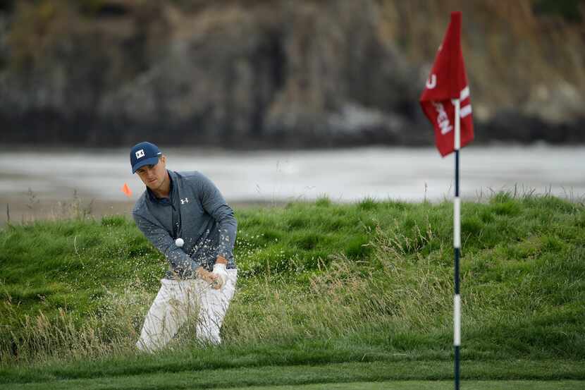 Jordan Spieth hits out of the bunker on the 17th hole during the second round of the U.S....