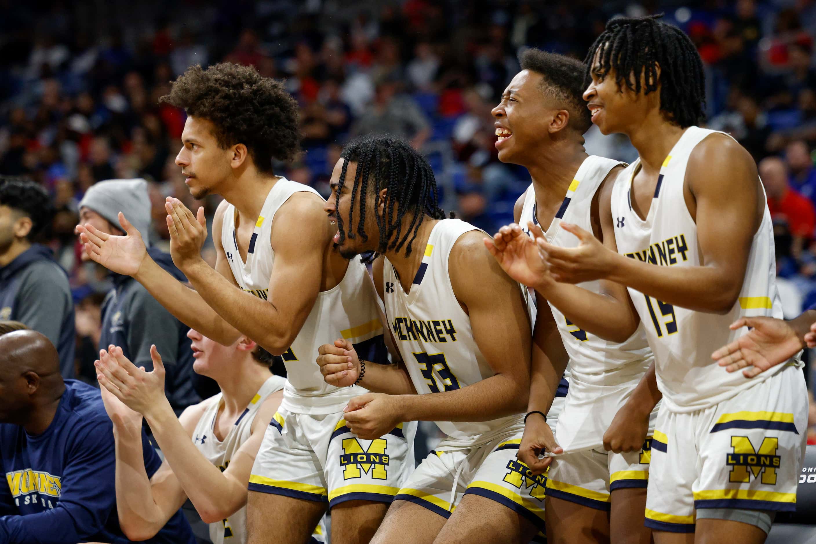 McKinney players celebrate a basket during the third quarter of the Class 6A state...