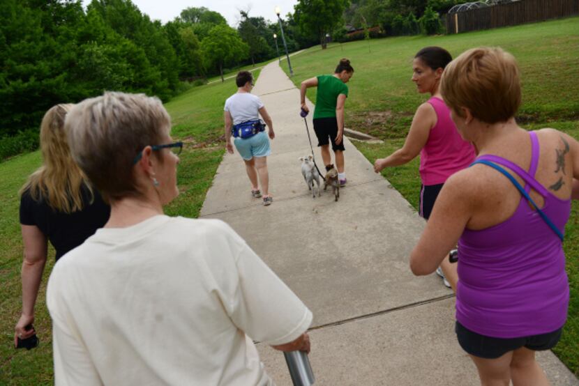 The Flower Mound Walking Women group walk the trails in Glenwick Park in Flower Mound. The...